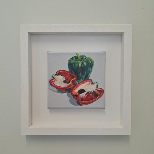 Oil painting. Close of one full green pepper and two halves of a red pepper on a grey background.